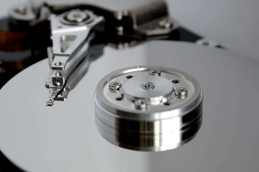 Detailed view of hard drive mechanism showcasing metallic precision parts.